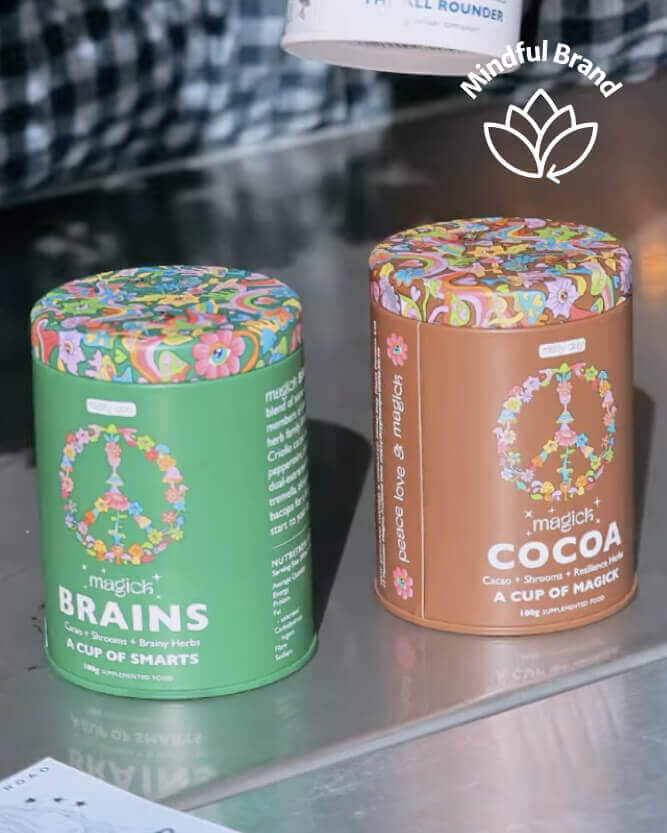 Two colorful tins labeled 'Brains' and 'Cocoa' on a reflective surface with a blurred background.