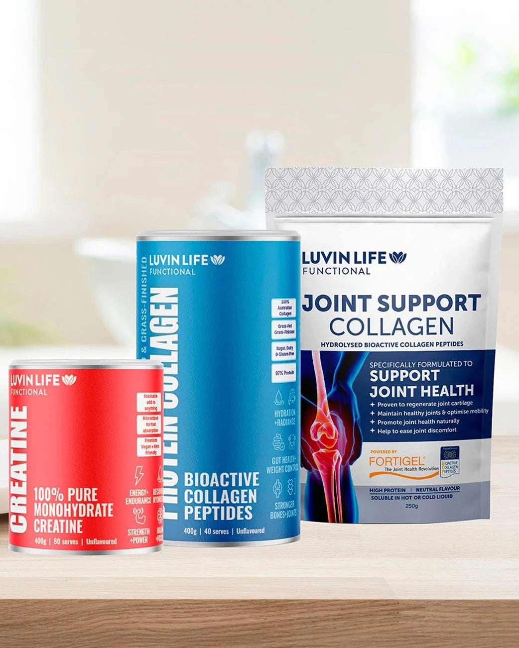 Three supplement containers from Luvin Life on a wooden surface with a blurred background