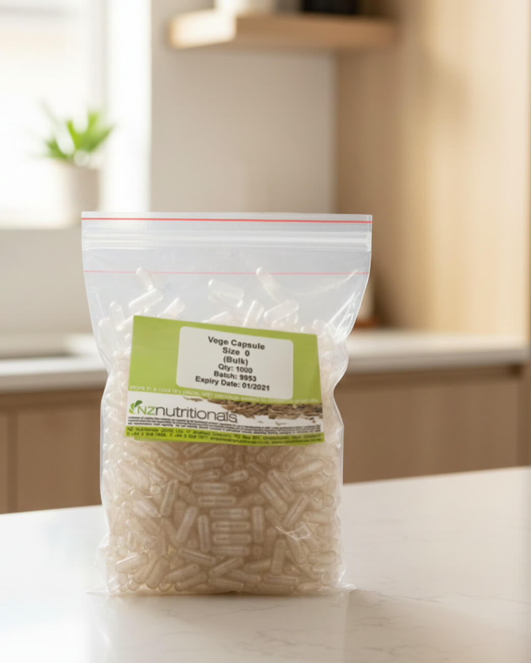 Bag of capsules with a label on a white surface.