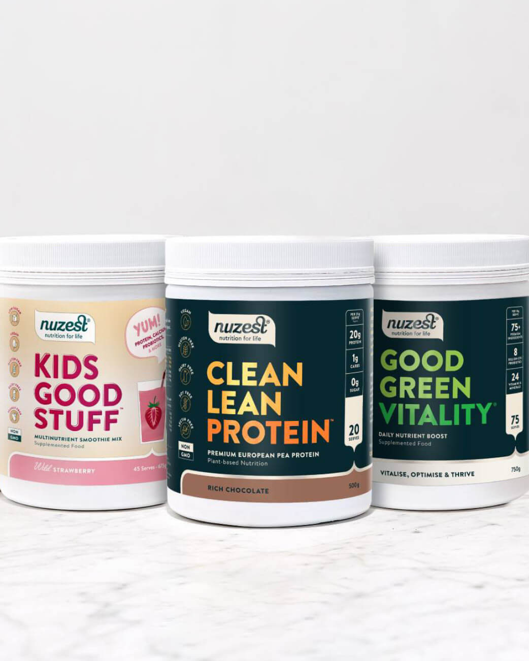 Three Nuzest protein powder containers on a white background.