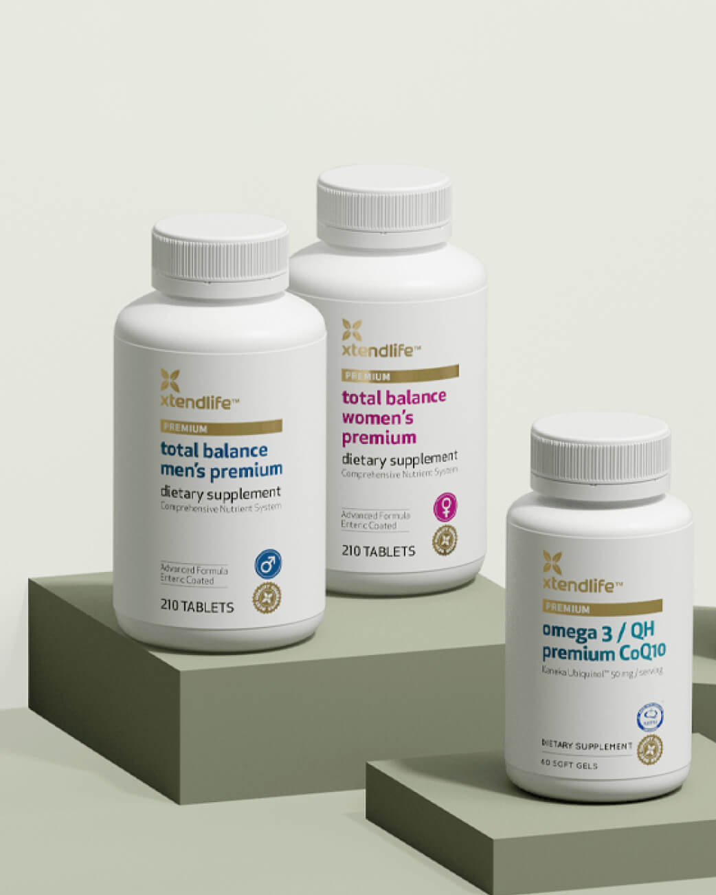 Three bottles of XtendLife supplements on a light grey background.