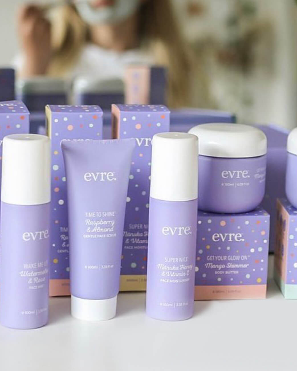 Evre skincare products with boxes on a white surface.