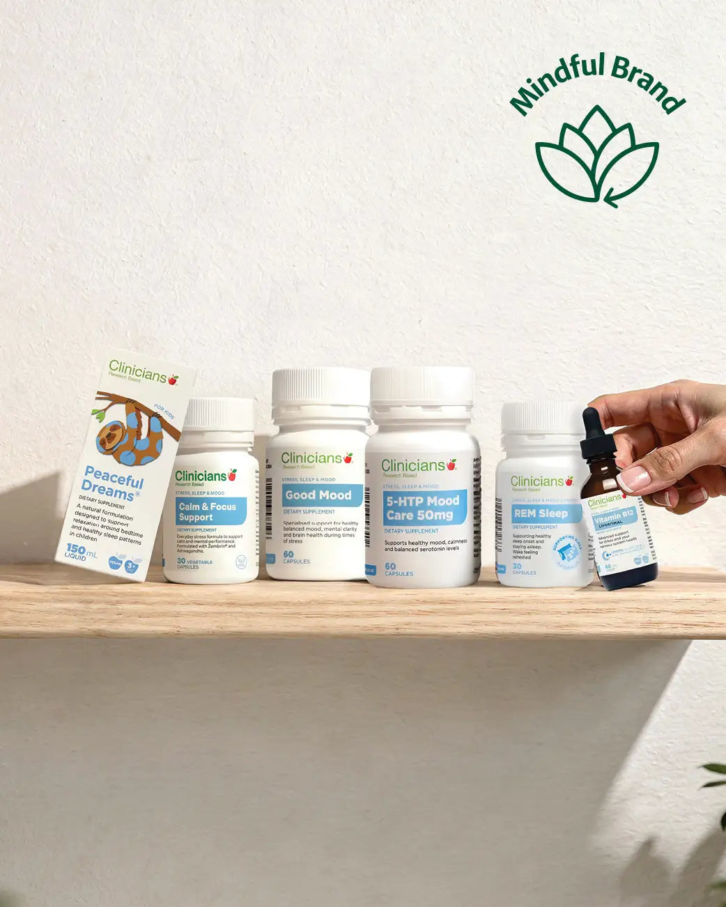 Clinicians sleep, stress and mood range on a wooden shelf with a green mindful brand logo in the top corner.