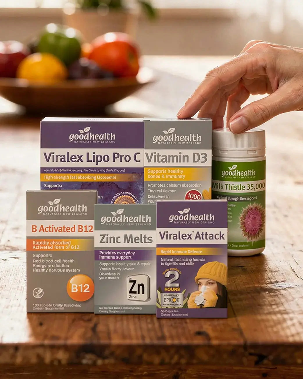 Assorted health supplement boxes on a wooden table with a blurred background.