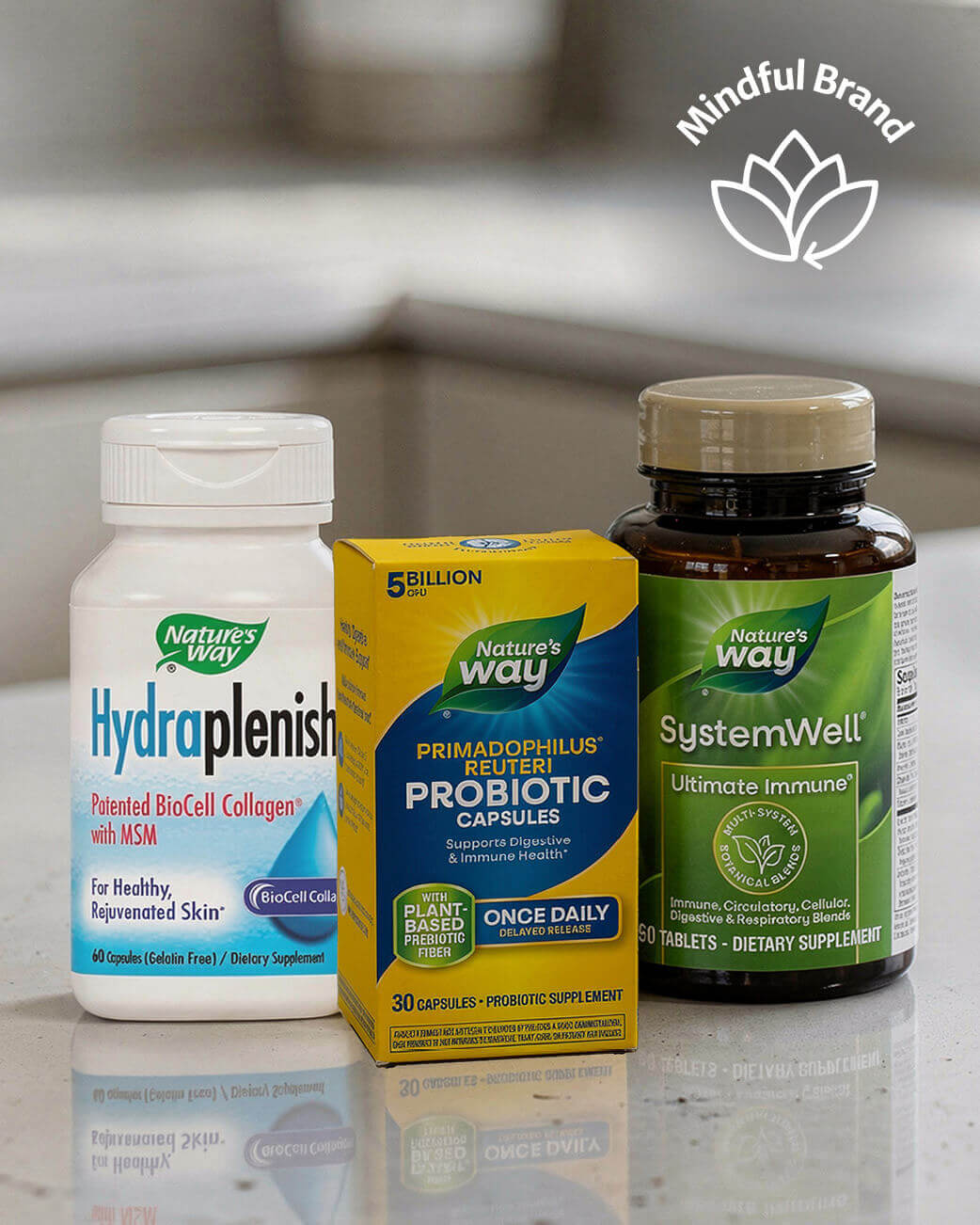 Nature's Way supplements including Hydрапlenish, Probiotic, and SystemWell on a reflective surface.