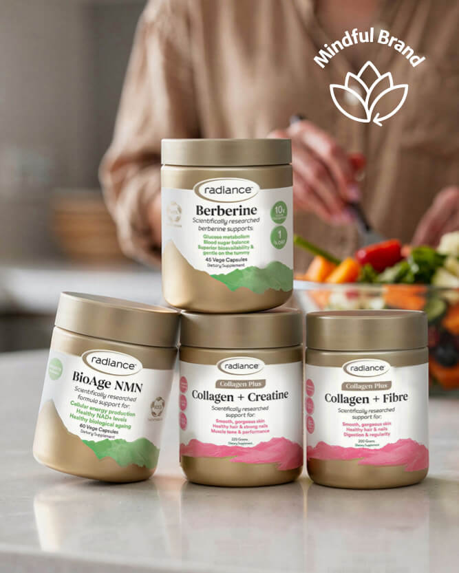 Radiance supplement containers with a blurred background of a person eating salad.