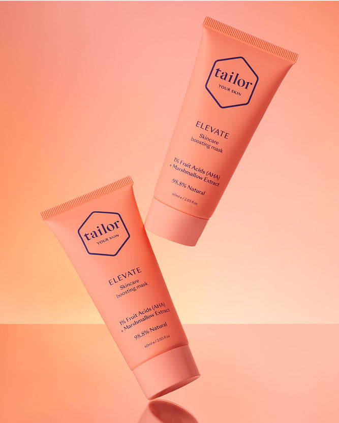 Two tubes of 'tailor' skincare product on a gradient pink background