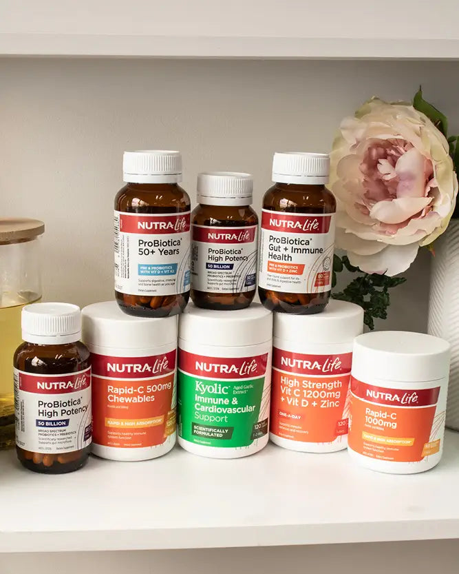 A collection of eight Nutra-Life dietary supplement products arranged on a white shelf, including bottles and jars of various strengths and formulations.
