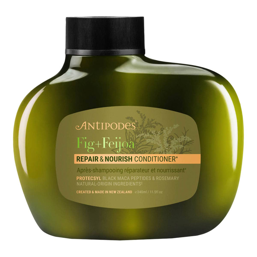 Green conditioner bottle with label on a white background.