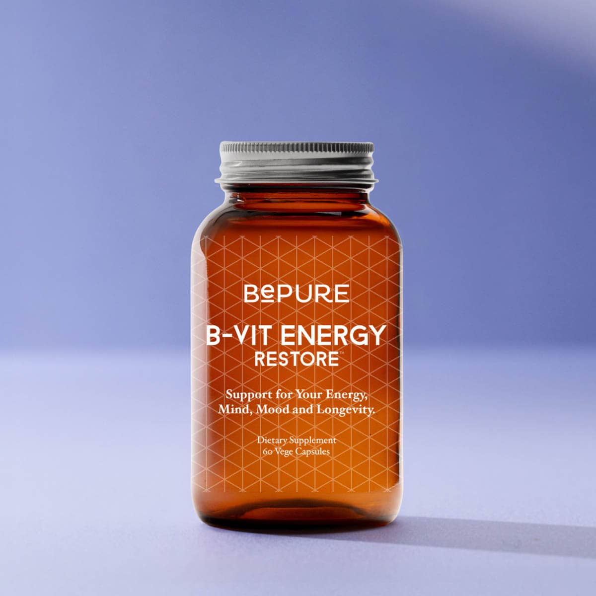 Brown supplement bottle labeled 'BEPURE B-VIT ENERGY RESTORE' on a light purple background
