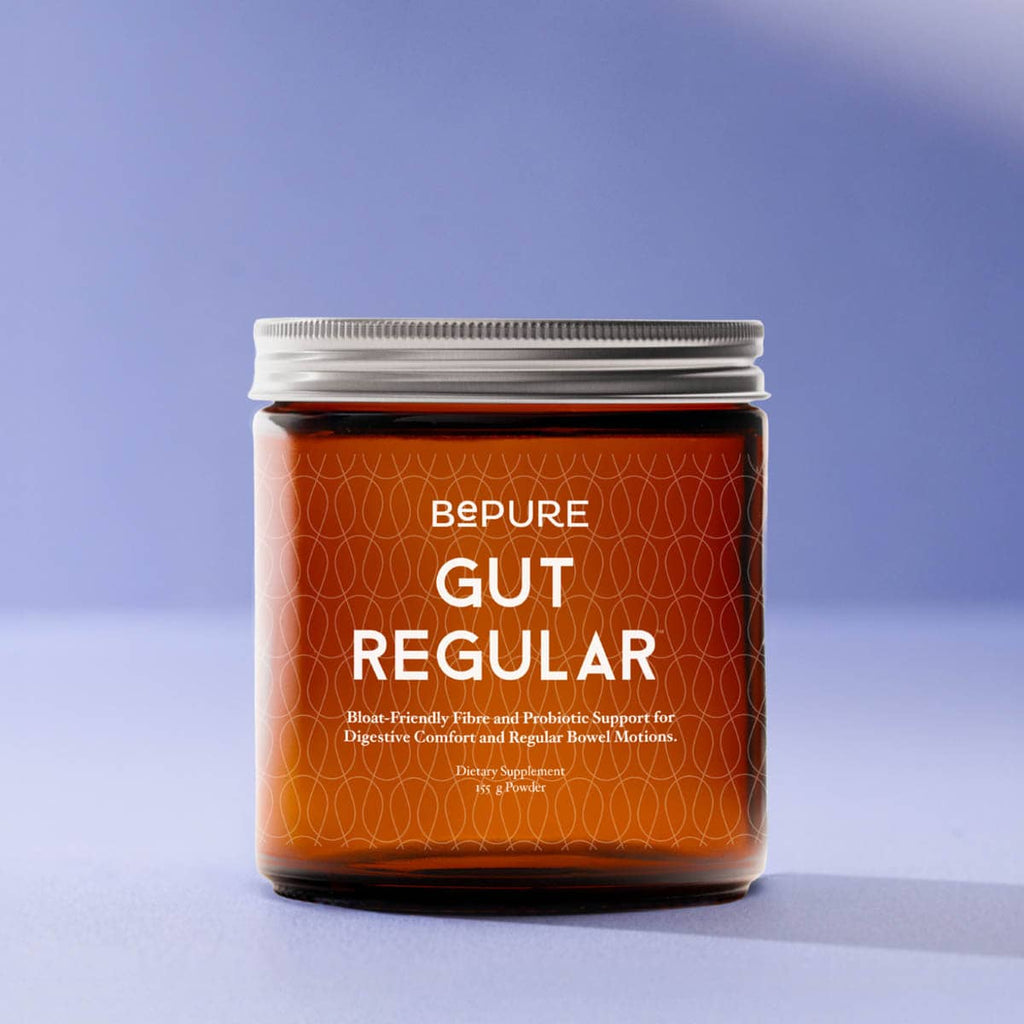 Jar of 'Gut Regular' supplement with 'BePure' branding on a light purple background