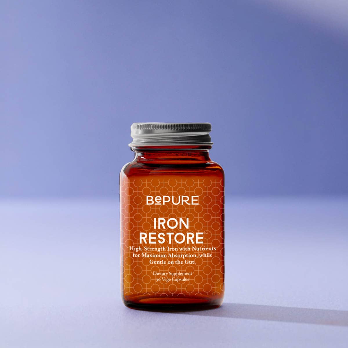 Supplement bottle labelled 'BePure Iron Restore' on a gradient purple background.