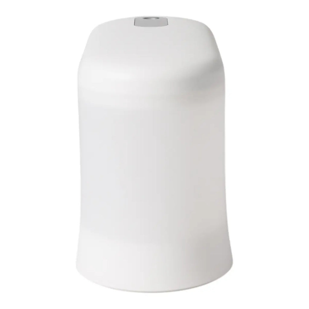 Side view of a white plastic humidifier and aroma diffuser on a white background.