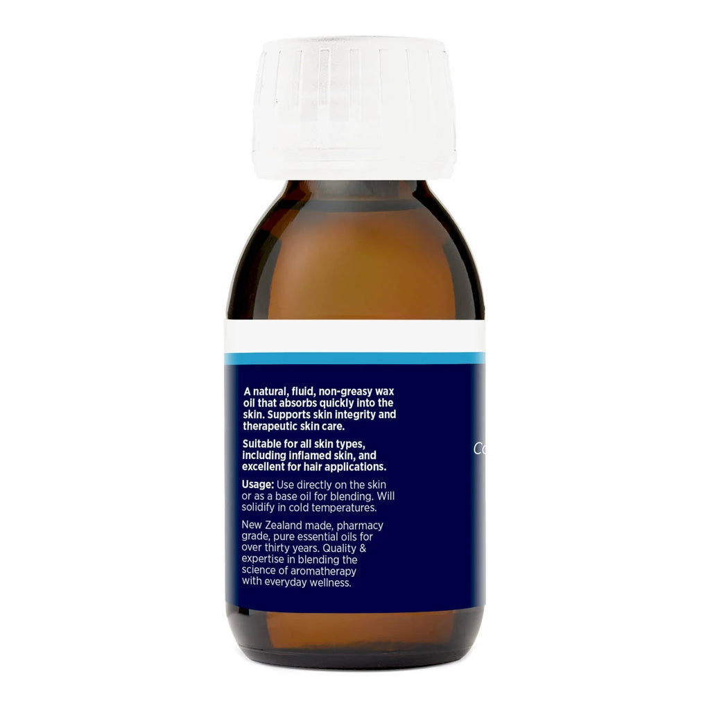 Back view of 100ml bottle of jojoba oil displaying product benefits & usage. NZ made pharmacy grade for use as therapeutic skincare or a base oil for blending.