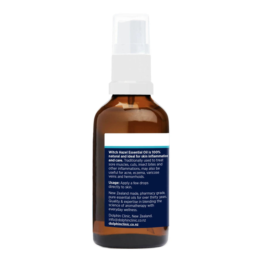 Back view of bottle of witch hazel spray with a blue label showing product benefits, usage & details.