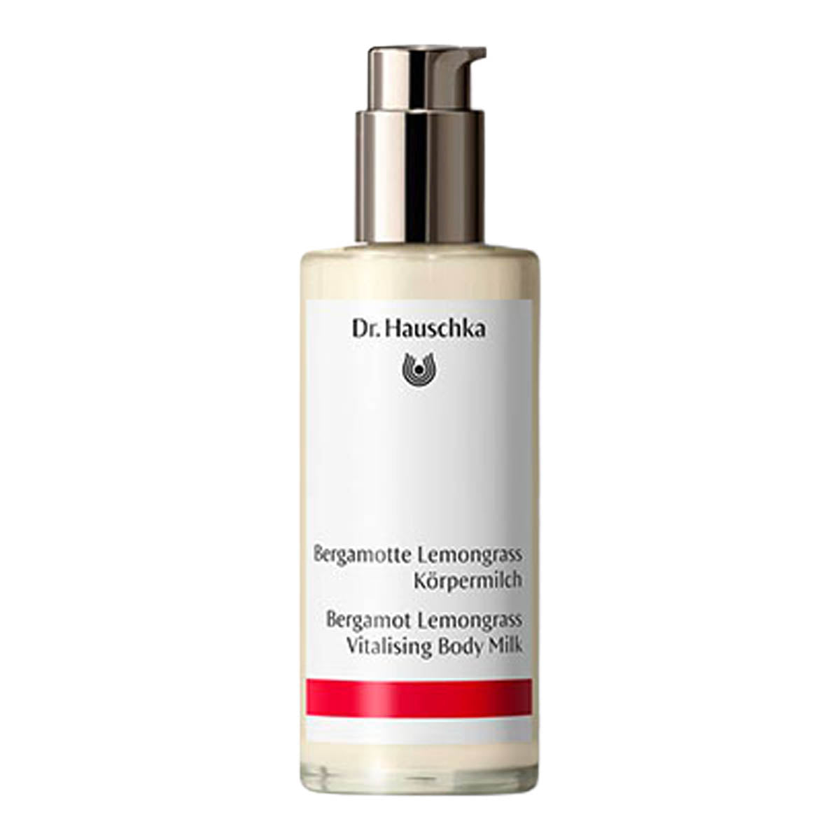 A bottle of Dr. Hauschka Bergamot Lemongrass Vitalising Body Milk, featuring a white label with black text and a red accent stripe, topped with a metallic silver pump dispenser, set against a plain white background.