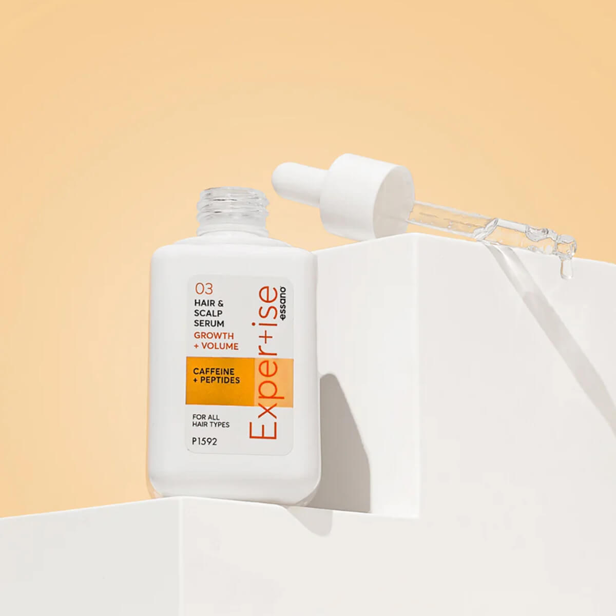 Expertise hair serum bottle on a light background.