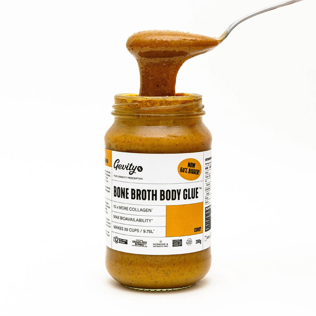 Jar of 'Bone Broth Body Glue' with a spoonful of the product on a white background.
