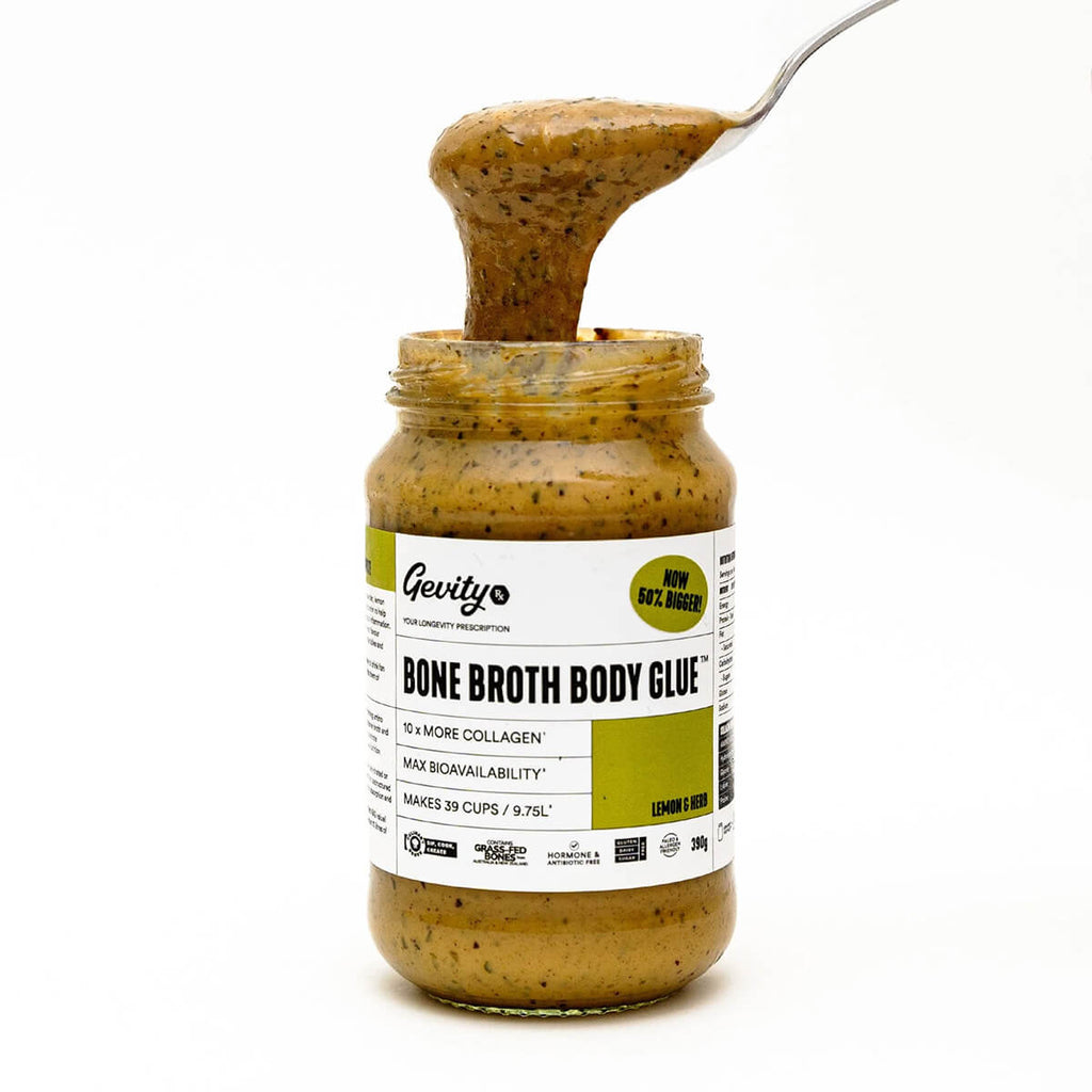 Jar of Gevity Bone Broth Body Glue with a spoonful being lifted out, on a white background.