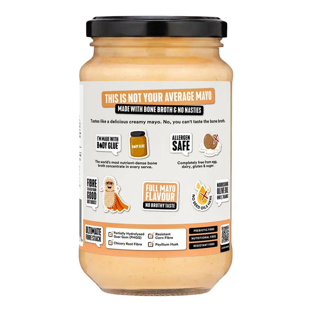 A jar of bone broth and no masties mayo with a black lid and a white label featuring orange and brown graphics, photographed on a clean white background.