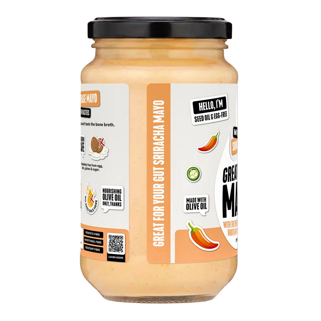 A glass jar of Ground Mango Chili Mayo with a black lid and a white and orange label, shown on a plain white background.