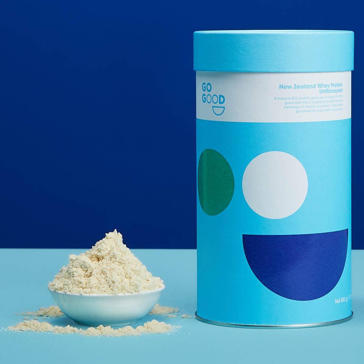 Blue cylindrical container labeled 'GO GOOD' with a scoop of powder on a blue background.