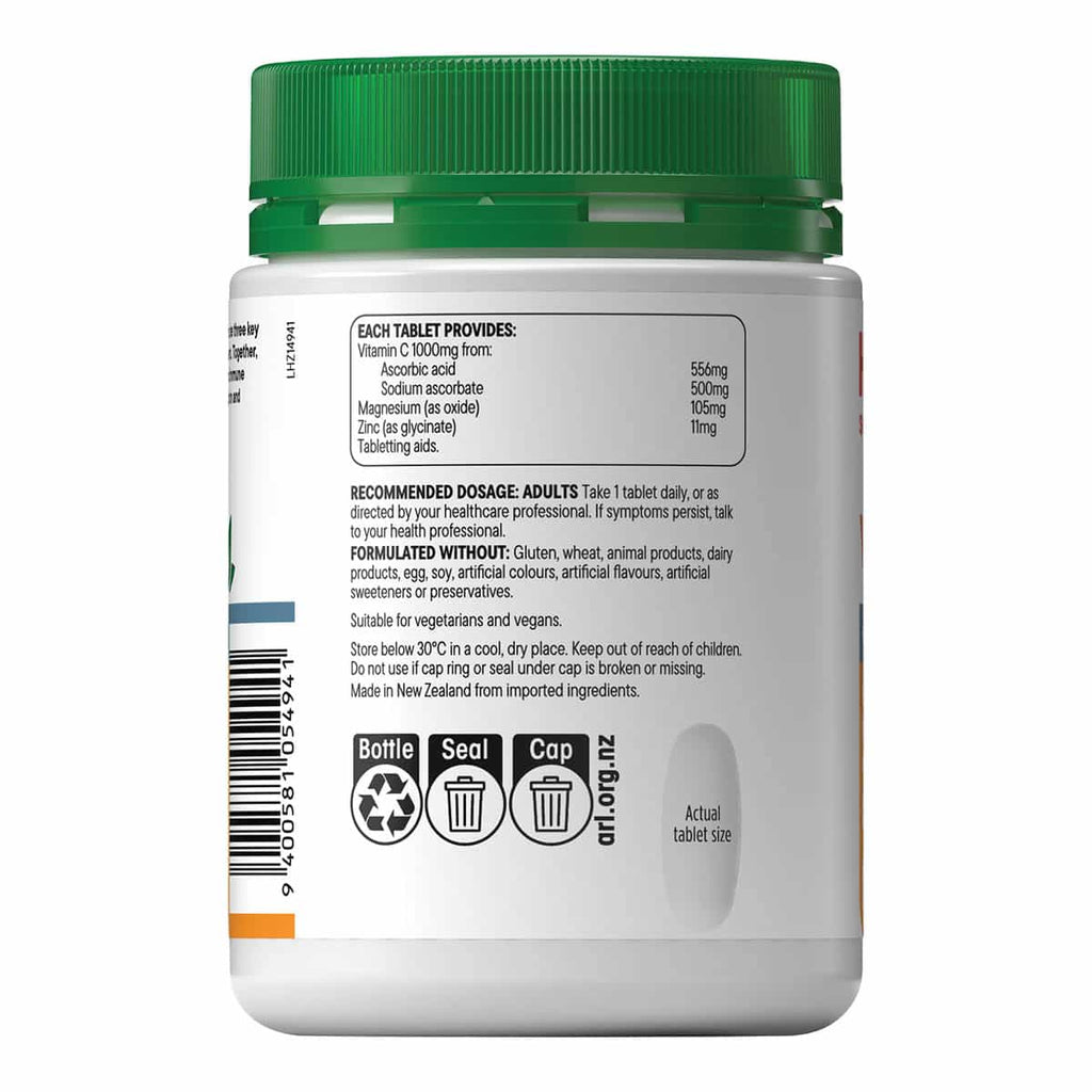 Supplement bottle with green cap and white label on a white background.