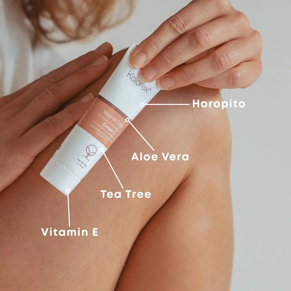 Kolorex product being applied to skin with labeled ingredients on a neutral background.