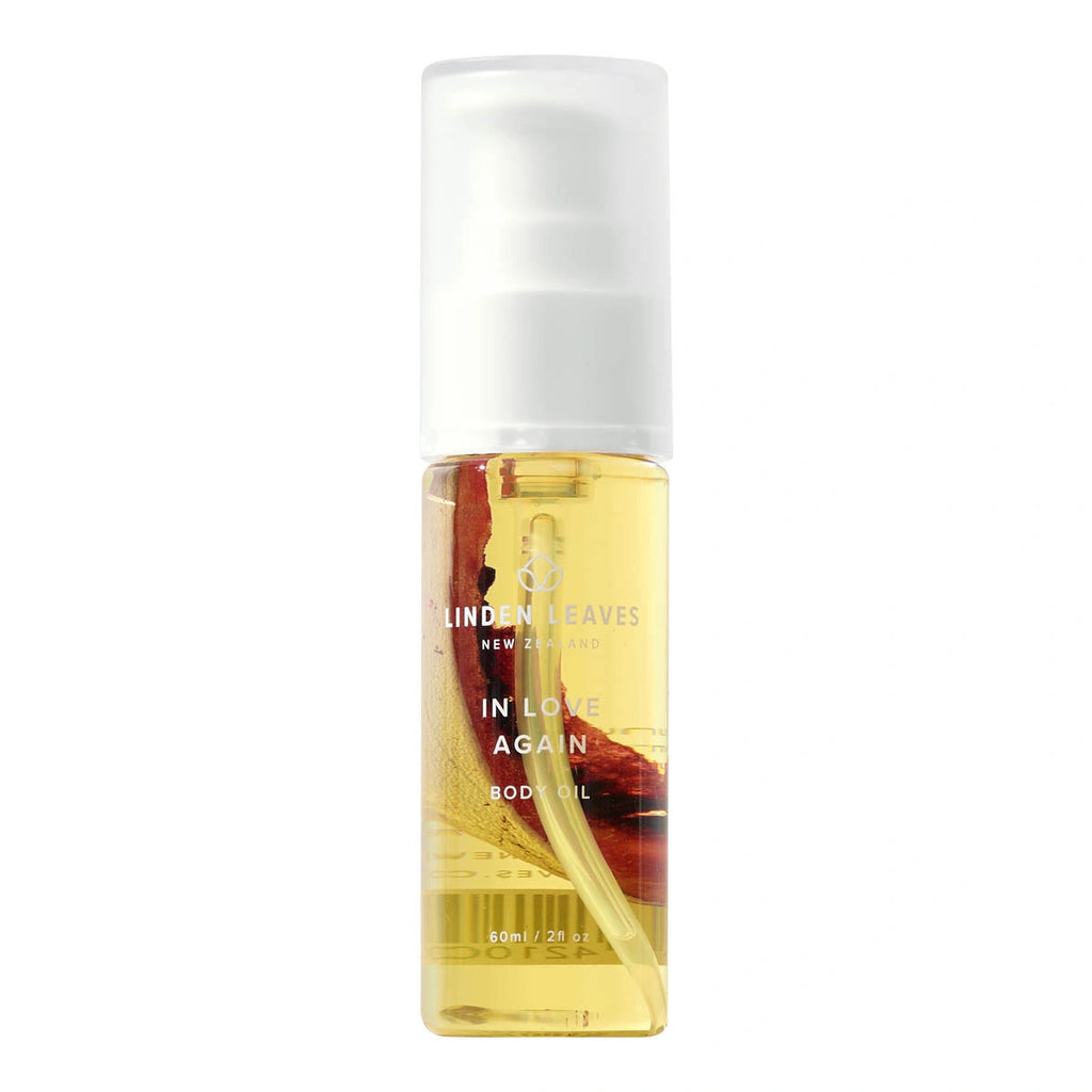 Bottle of Linden Leaves body oil on a white background. 60ml pump bottle.