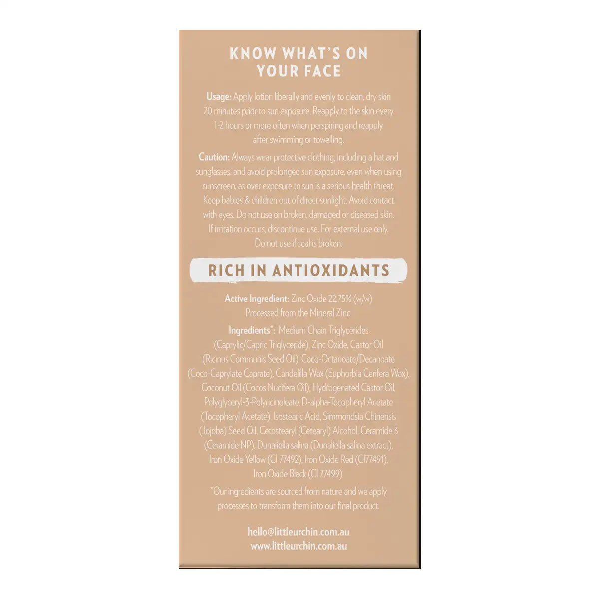 A beige product box with black text detailing the usage, caution, and ingredients of tinted sunscreen.