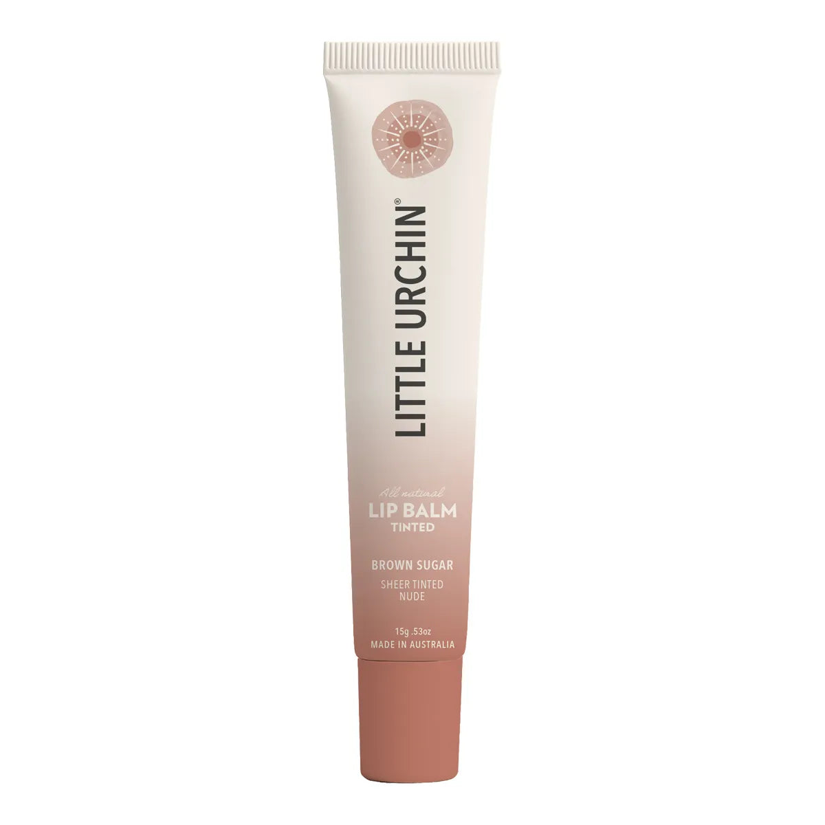 A tube of Little Urchin Lip Balm in the shade Brown Sugar, featuring a cream-to-rose gold gradient design with black text, set against a plain white background.