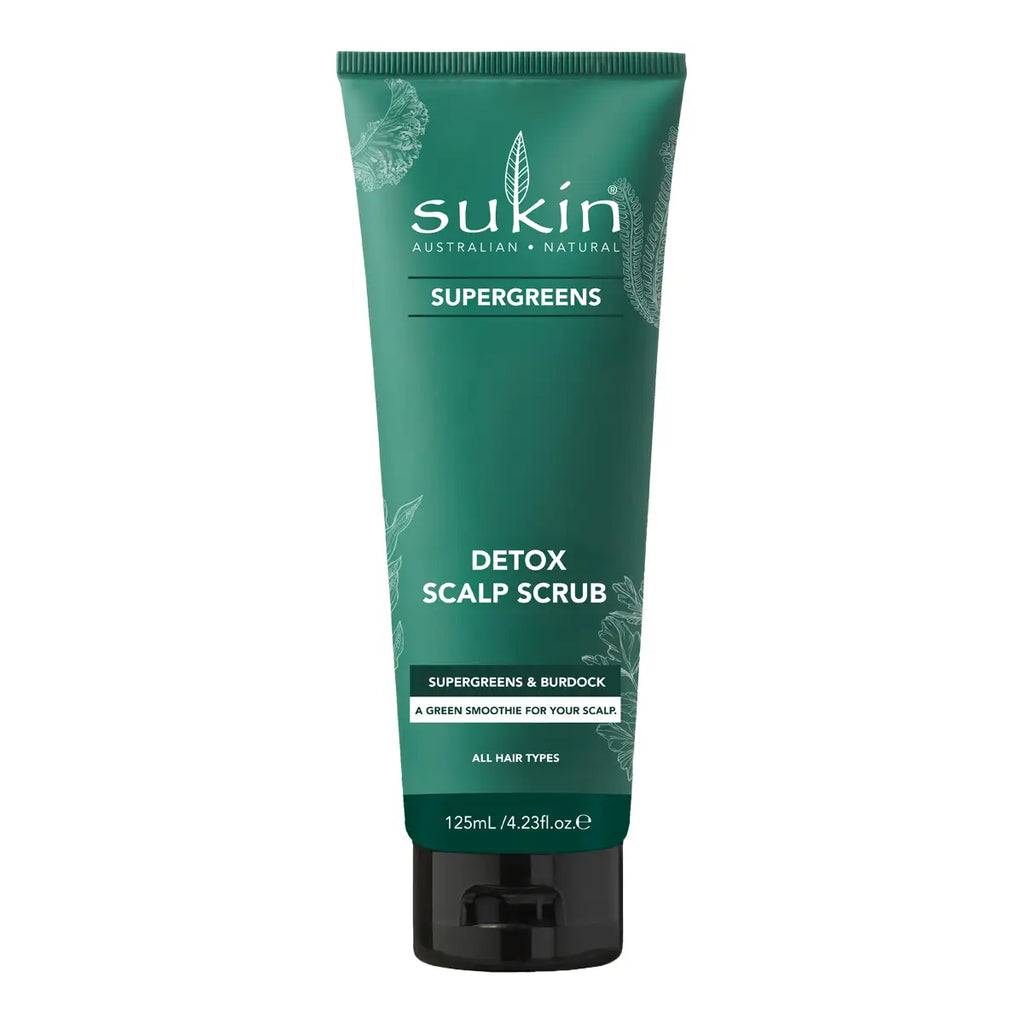 A 125ml squeeze tube of Sukin Supergreens Detox Scalp Scrub, featuring a dark green body with white text and a black cap, set against a plain white background.
