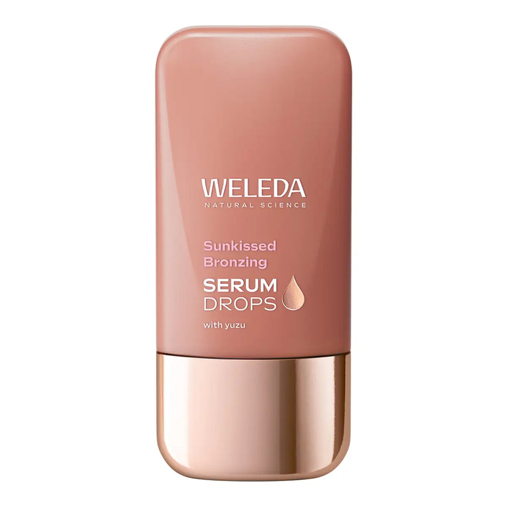 Weleda Sunkissed Bronzing Serum Drops in a rectangular bottle with rounded corners, featuring a tan body and a metallic rose gold cap.
